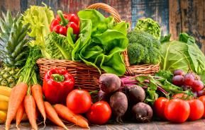 A basket overflowing with freshly picked ripe vegetables