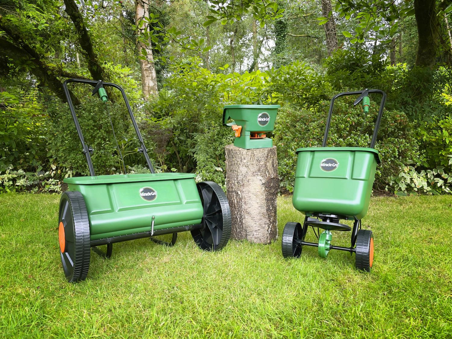 Range of Miracle-Gro Lawn Spreaders displayed on a lawn.